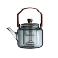 Teekanne i Glass med Trehåndtak – Elegant Design for Tedrikking