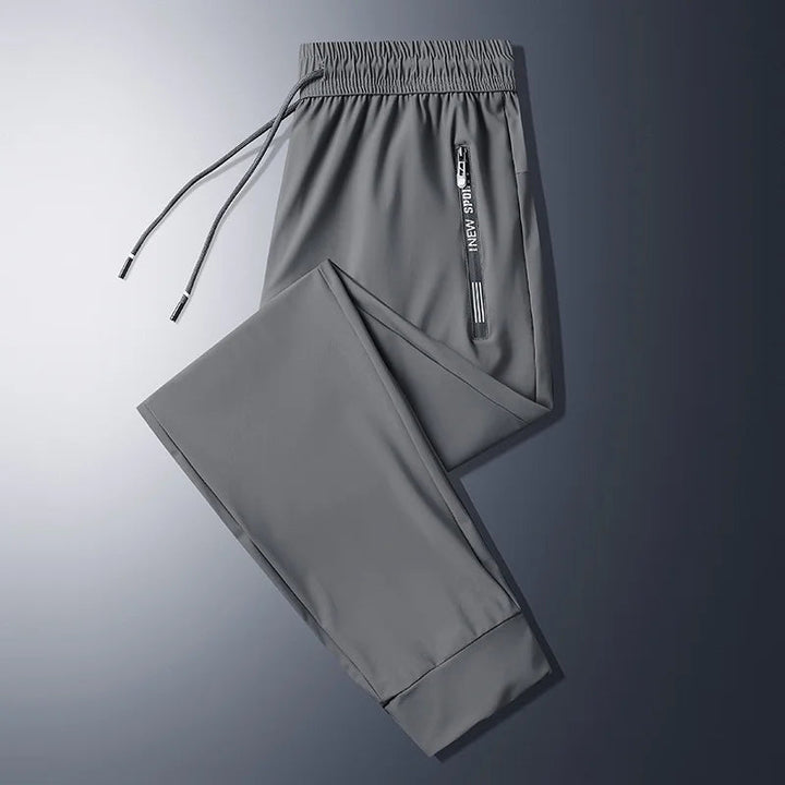 Herre Joggebukse med Glidelåslommer for Komfort og Stil